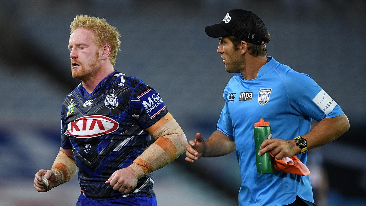 James Graham of the Bulldogs leaves the field after sustaining a head injury