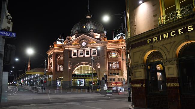 A deserted Flinders Street Station shortly after the 8pm curfew came into force in Melbourne on Sunday. Picture: Josie Hayden