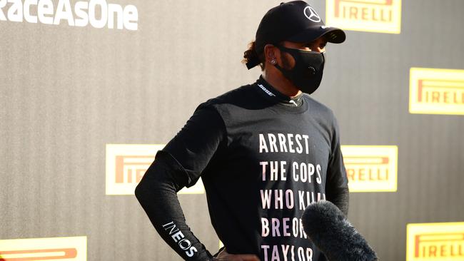 SCARPERIA, ITALY - SEPTEMBER 13: Race winner Lewis Hamilton of Great Britain and Mercedes GP wears a shirt in tribute to the late Breonna Taylor as he talks to the media in parc ferme during the F1 Grand Prix of Tuscany at Mugello Circuit on September 13, 2020 in Scarperia, Italy. (Photo by Bryn Lennon/Getty Images)