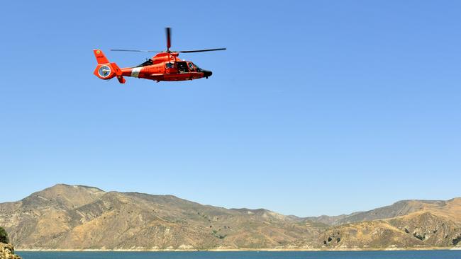 Coast Guard helicopter flies over Lake Piru, where actress Naya Rivera was reported missing. Picture: Getty.