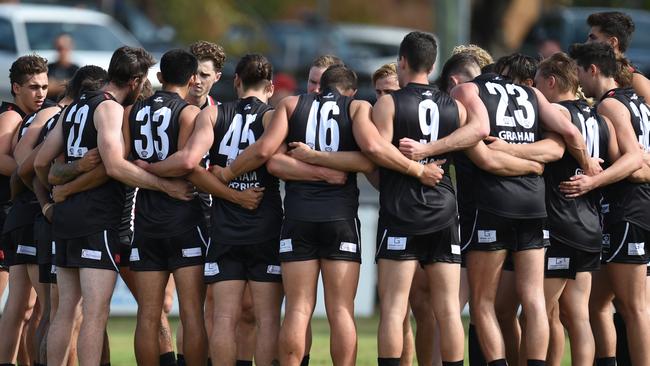 The boys huddle before a VFL practice match against Port Melbourne. Picture: Jason Sammon