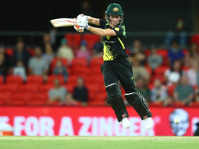 Beth Mooney gets airborne to slash one square of the wicket. Picture: Getty Images