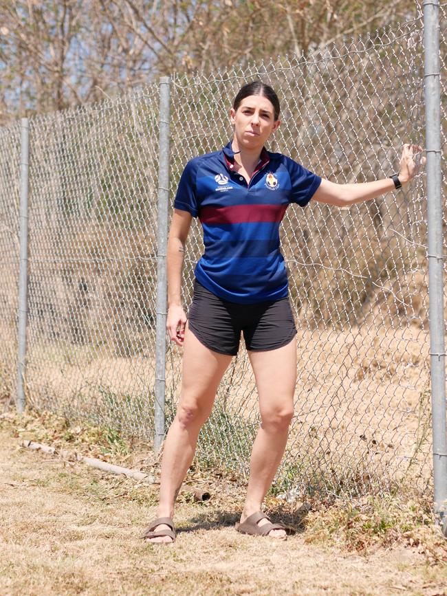 Monique Sullivan pulls on the repaired fence that was cut. Picture: Blair Jackson