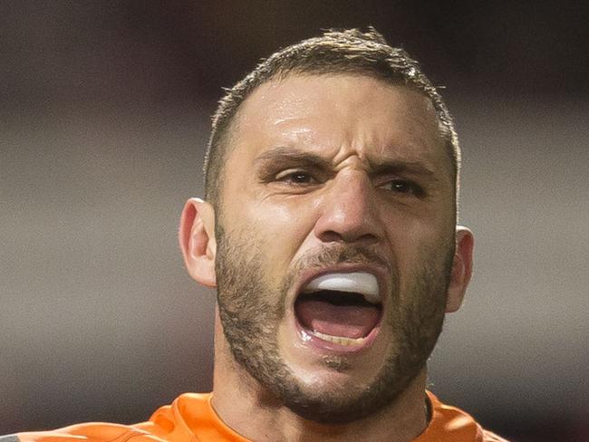 Robbie Farah of the Tigers celebrates at full time during the Round 18 NRL match between the St George-Illawarra Dragons and the Wests Tigers at UOW Jubilee Oval in Sydney, Sunday, July 15, 2018. (AAP Image/Craig Golding) NO ARCHIVING, EDITORIAL USE ONLY