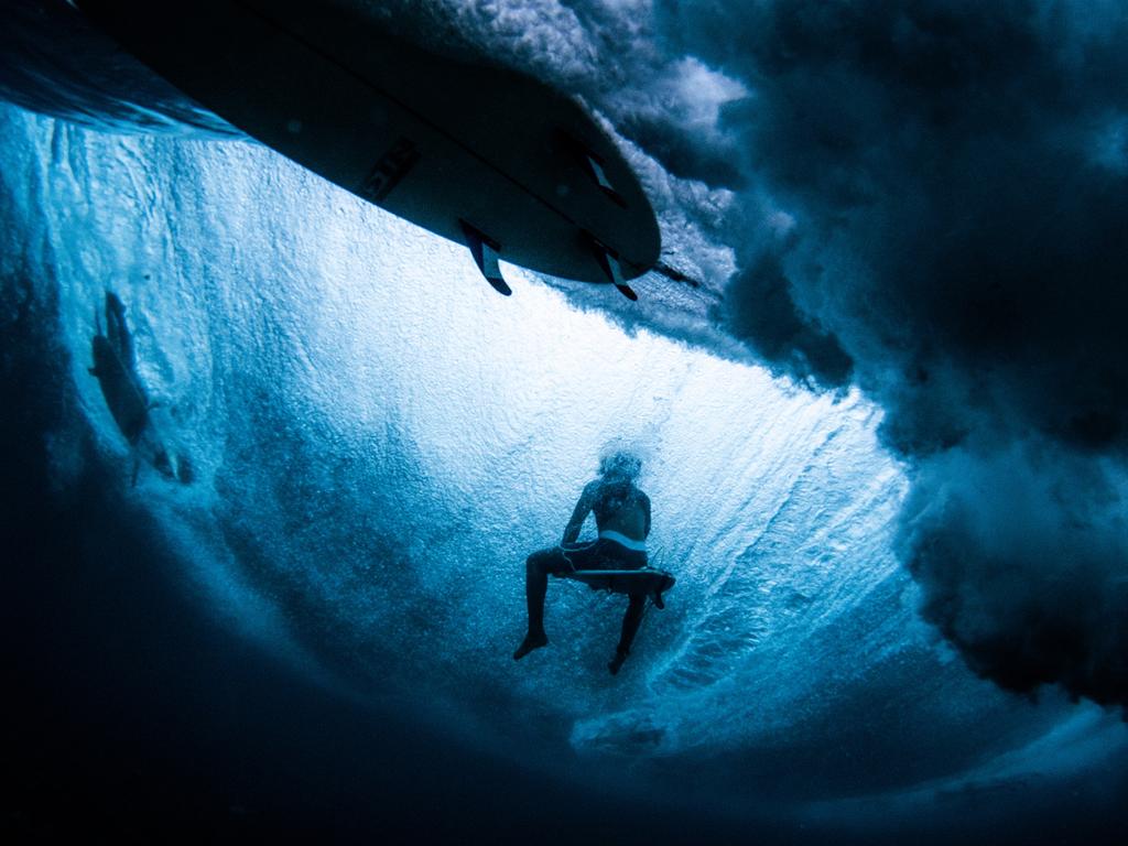 Image Name: Under Under Photographer Name: Gaps Sabuero Year: 2018 Image Description: There is just so much going on in a line-up. It’s where all surfers wait for waves and their turn to paddle into them. This image shows what goes on underneath when a single wave passes, someone riding it, someone paddling away from it and someone waiting his. Copyright: Gaps Sabuero, Winner, Philippines National Award. Picture: Sony World Photography Awards/ Gaps Sabuero
