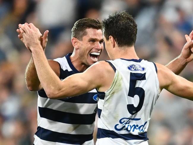 Tom Hawkins celebrates a goal with teammate Jeremy Cameron. Picture: Quinn Rooney/Getty Images