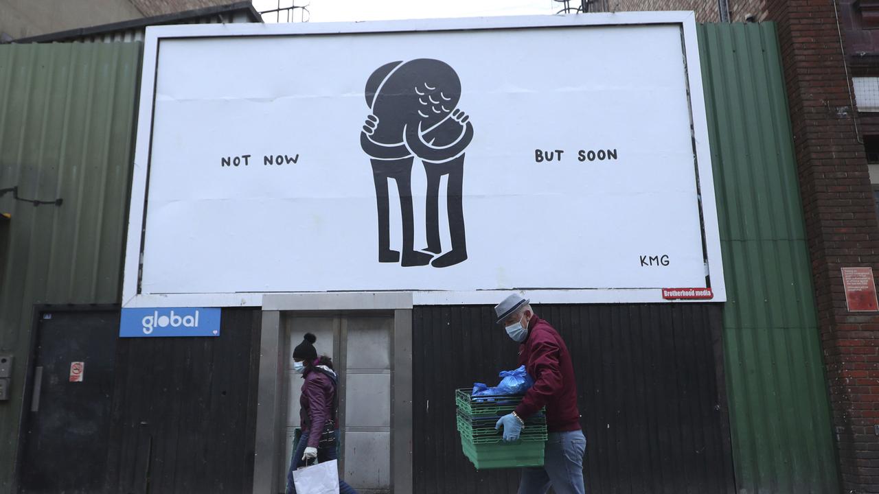 A coronavirus-themed poster by mural artist and illustrator KMG in Camden, London, Sunday May 10, 2020. Picture: Yui Mok/AP