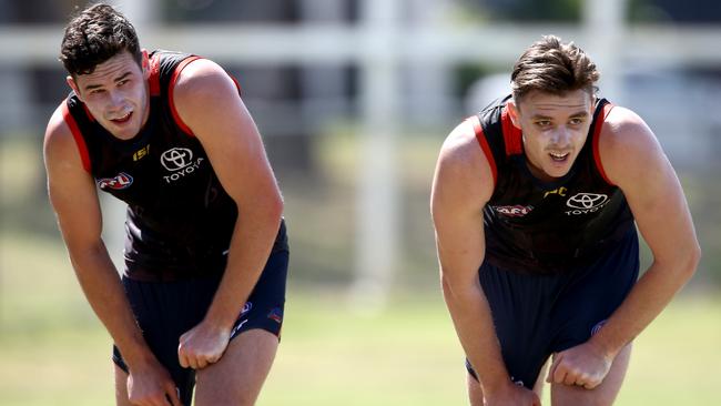 Adelaide Crows’ Mitch McGovern and Jake Lever exhausted at training on the Gold Coast.