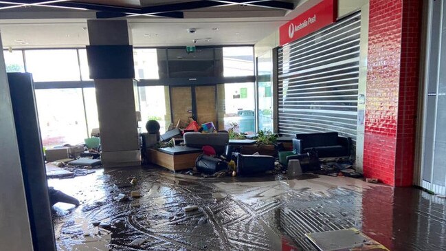 Mud and ruined furniture outside the Australia Post outlet, which is closed for the foreseeable future. Picture: Facebook