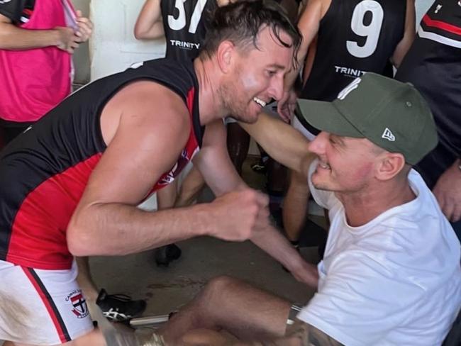 Cade Wellington (L) Wayne Pavitt (R) embracing after Saints Victory. AFL Cairns. Saints.