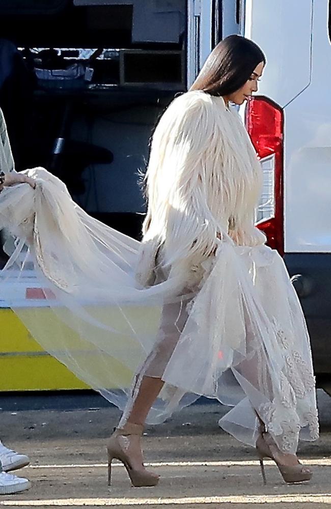 The dress featured a long, sheer train that Kardashian paired with nude stilettos.