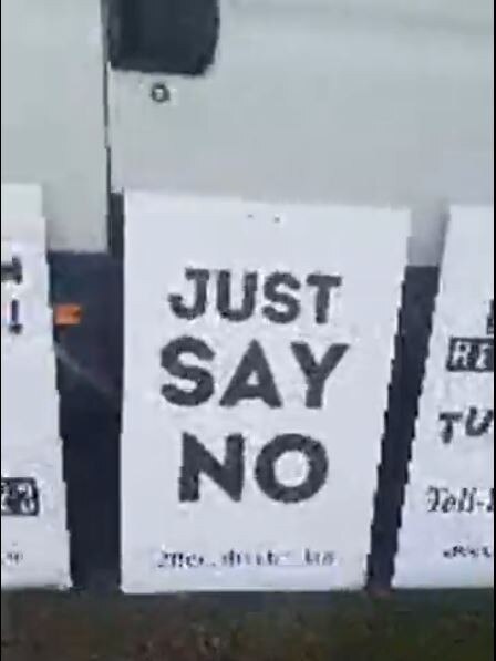 A screenshot from Tom Barnett's live Facebook video of his protest van outside Byron Bay High. Source: Facebook