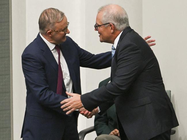 CANBERRA, AUSTRALIA, NewsWire Photos. FEBRUARY 27, 2024:  The Prime Minister, Anthony Albanese shakes Scott Morrison's hand after his valedictory speech to Parliament in the House of representatives at Parliament House in Canberra. Picture: NCA NewsWire / Martin Ollman