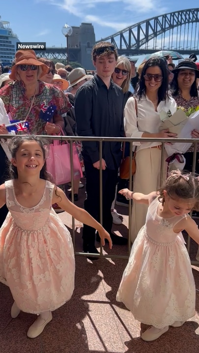 Charlotte and Grace practice their curtsey