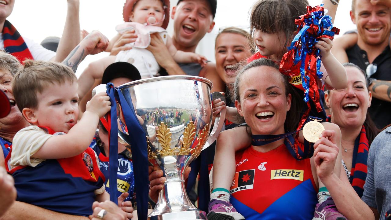 Daisy Pearce celebrates what was ultimately her last game for Melbourne, the 2022 premiership - with her twins, Sylvie and Roy. Picture: Dylan Burns/AFL Photos via Getty Images