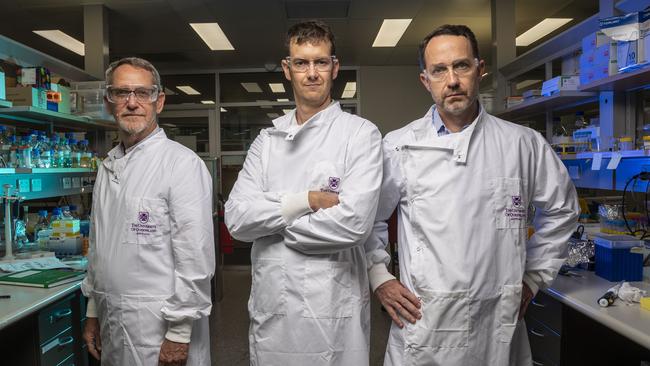 From left, Paul Young, Keith Chappell and Trent Munro at Queensland University where they are racing to develop what may be the first viable vaccine. Picture: Glenn Hunt