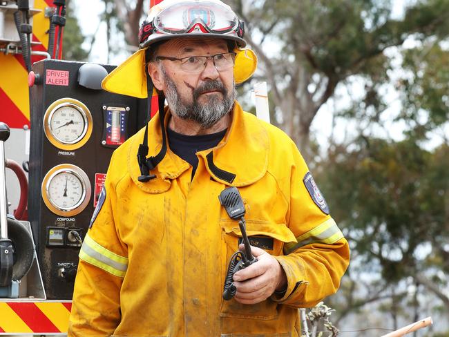 Firefighter Peter Johnstone from Collinsvale Fire Brigade on the fire ground at the Collinsvale Rd, Glenlusk blaze. Picture: NIKKI DAVIS-JONES