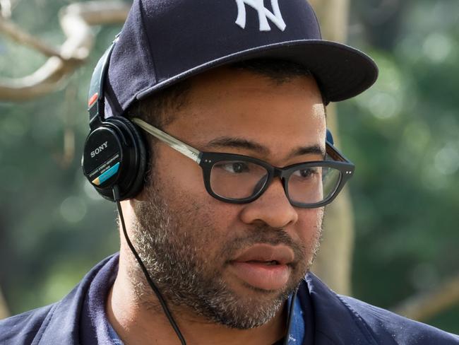 Writer director Jordan Peele talks to actor Betty Gabriel on the set of film Get Out