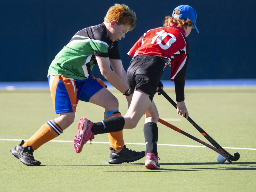 Newtown Norths Tigers Oskar Greer (left) and Ripley Wood Past High in under-11 boys Presidents Cup hockey at Clyde Park, Saturday, May 27, 2023. Picture: Kevin Farmer