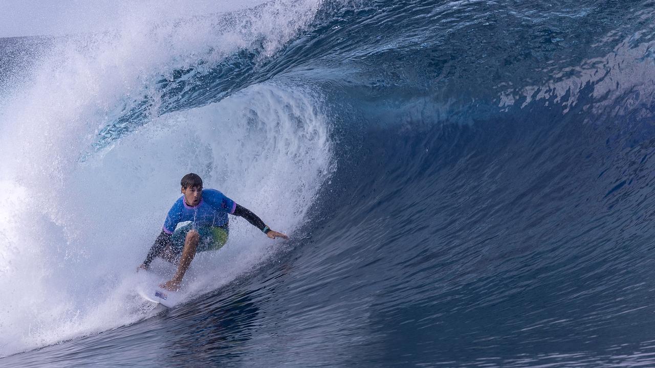 Jack Robinson of Team Australia rides a wave during round one of surfing on day one in Teahupo'o, French Polynesia. (Photo by Sean M. Haffey/Getty Images)