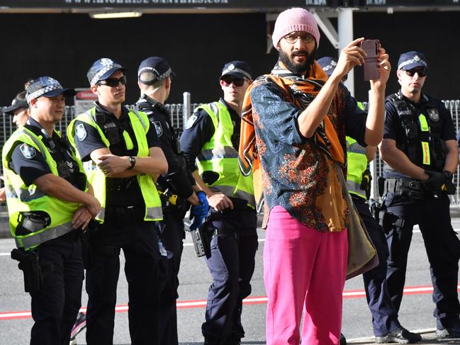 Brisbane City Council councillor Jonathan Sri (centre) is seen during a Black Lives Matter protest outside the Roma Street Magistrates Court in Brisbane, Wednesday, June 17, 2020. (AAP Image/Darren England) NO ARCHIVING