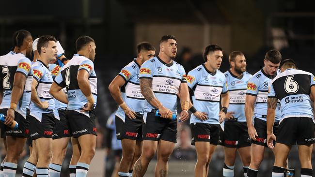 A dejected Sharks during the Round 5 NRL match between the St. George Illawarra Dragons and the Cronulla Sutherland Sharks at Campbelltown Stadium in Sydney, Sunday, June 14, 2020. (AAP Image/Brendon Thorne) NO ARCHIVING, EDITORIAL USE ONLY