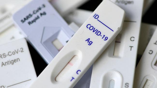 An illustration shows used Corona rapid tests with negative results in Dortmund, western Germany on January 20, 2022, during the ongoing coronavirus (Covid-19) pandemic. - Like in other European countries, the number of daily new coronavirus infections is rising, as the Omicron variant sparked a renewed surge in transmissions. (Photo by Ina FASSBENDER / AFP)