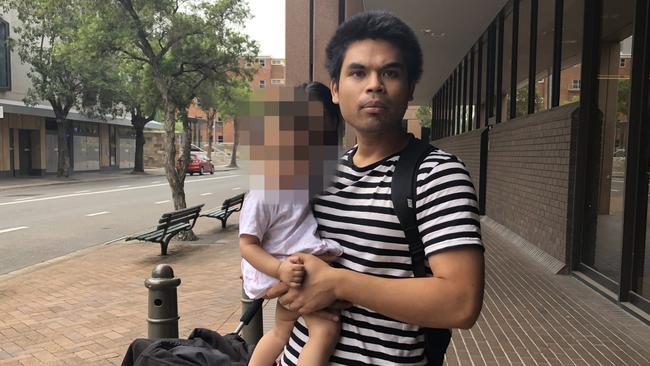 Accused disqualified driver Aung Win with his daughter outside Parramatta Local Court.