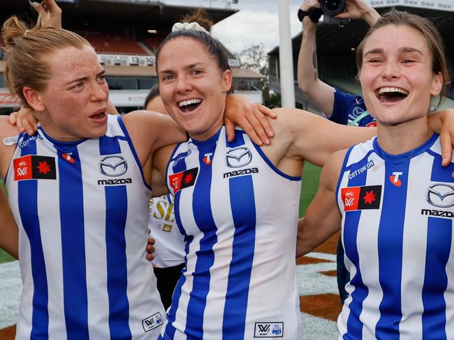 MELBOURNE, AUSTRALIA - NOVEMBER 23: The Kangaroos sing the team song during the 2024 AFLW First Preliminary Final match between the North Melbourne Tasmanian Kangaroos and the Port Adelaide Power at IKON Park on November 23, 2024 in Melbourne, Australia. (Photo by Dylan Burns/AFL Photos via Getty Images)