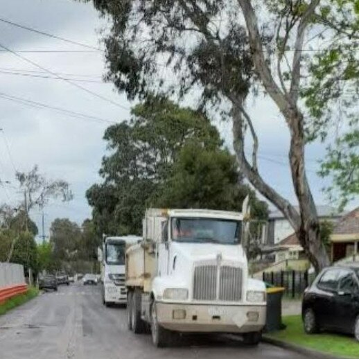 Trucks lined up on the Brooklyn street.