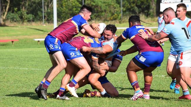 Tough to handle. Kirren Roughley of the Milton-Ulladulla Bulldogs getting taken down by four men. Photo: Contributed