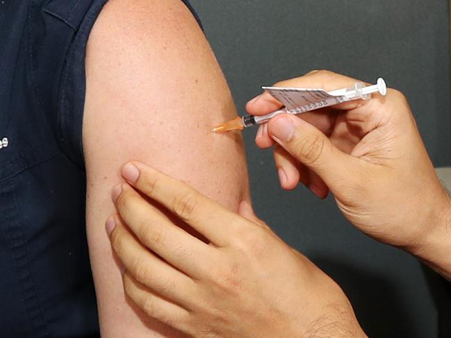 Infectious Diseases nurse Tiffanie O'Leary having the Pfizer Vaccination at Princess Alexandra Hospital. Pics Tara Croser.