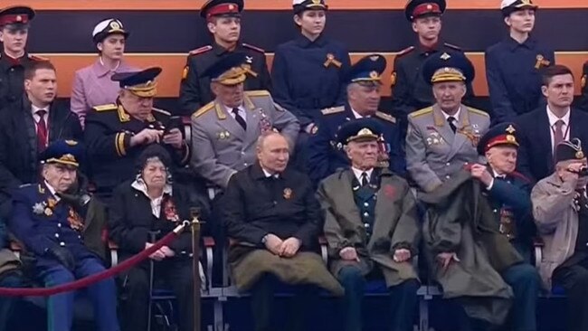 Vladimir Putin seen huddling under a thick blanket during the Victory Day parade in Moscow. Picture: Supplied.