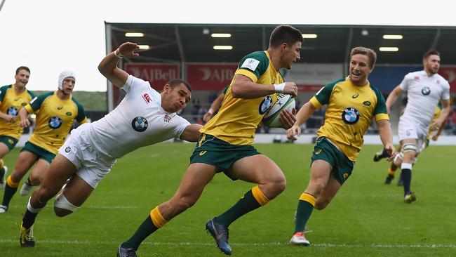 Jack Maddocks of Australia scores a try against England at the world under-20 championship.