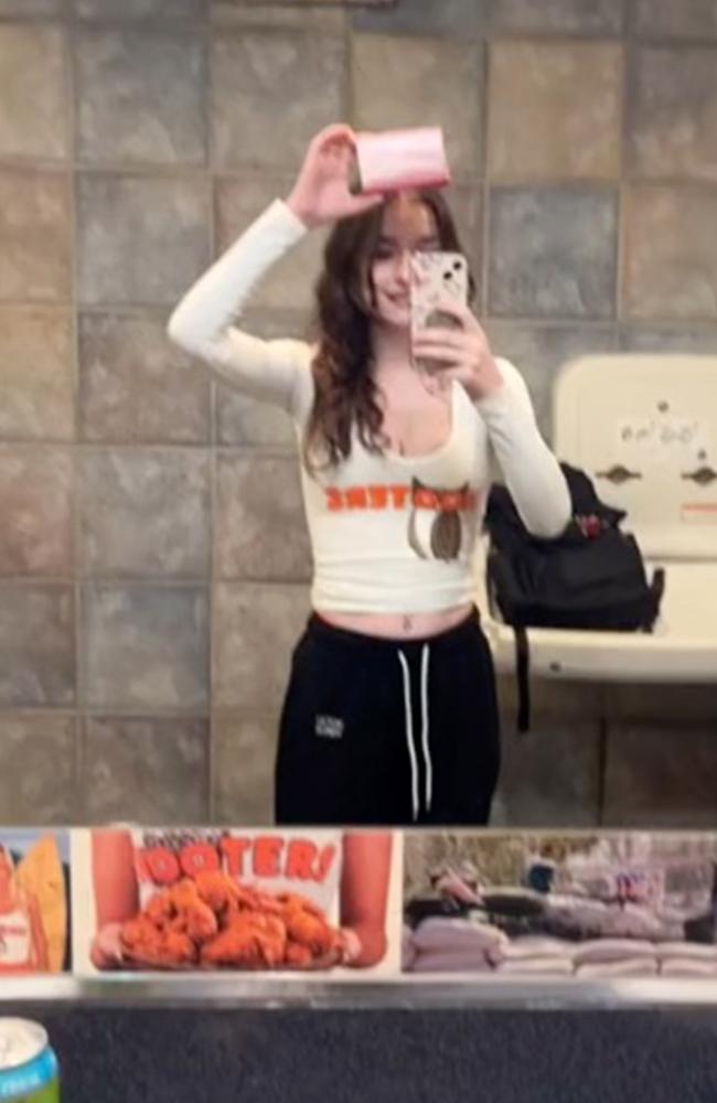 The TikTok user shows off the little pink box of stockings she received from the restaurant’s vending machine. Picture: TikTok/kenzjee