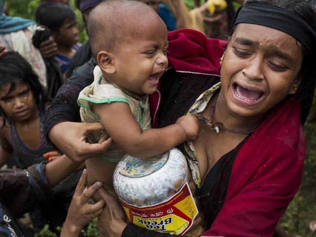 A Rohingya woman breaks down after a fight erupted during food distribution by local volunteers at Kutupalong, Bangladesh. Picture: Bernat Armangue/AP