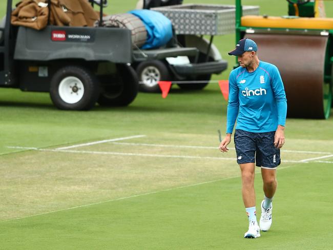 BRISBANE, AUSTRALIA - DECEMBER 06: Joe Root inspects the pitch during an England Ashes squad practice session at The Gabba on December 06, 2021 in Brisbane, Australia. (Photo by Chris Hyde/Getty Images)