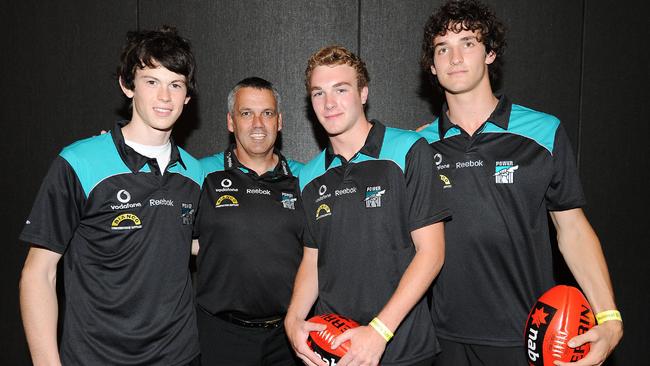 Port Adelaide’s 2009 coach Mark Williams with Jasper Pittard, Andrew Moore and John Butcher.