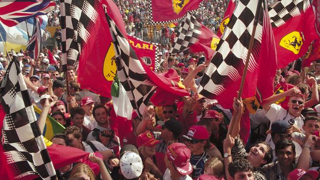 A crowd of enthusiastic fans wave Ferrari flags at the 1997 Australian Grand Prix. Picture: Pascal Le Segretain/Sygma via Getty Images