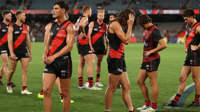 Essendon players look dejected after their loss to Brisbane. Picture: Getty Images