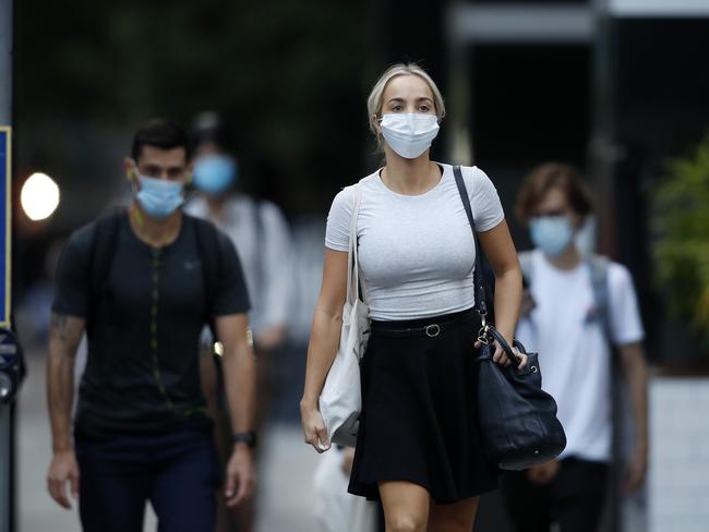 Pedestrians in the Brisbane CBD after 5pm Monday when mask wearing became mandatory. Picture: Josh Woning