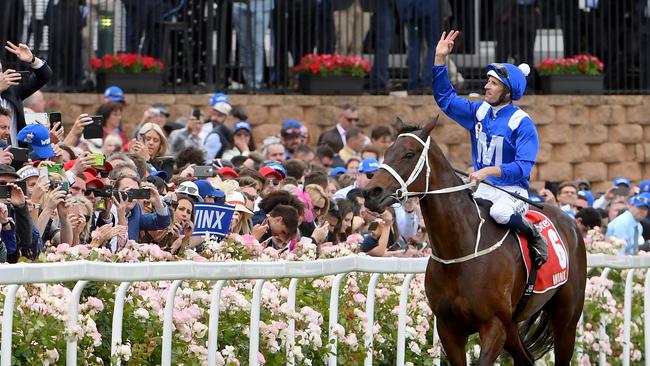 Winx with Hugh Bowman after winning last year’s Cox Plate. Picture Jay Town