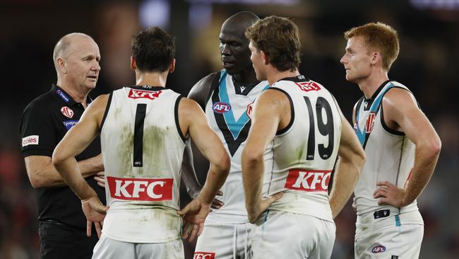 Ken Hinkley, head coach of the Power talks with Connor Rozee, Mitch Georgiades, Willem Drew and Aliir Aliir at half time against Essendon at Marvel Stadium. Picture: Michael Klein