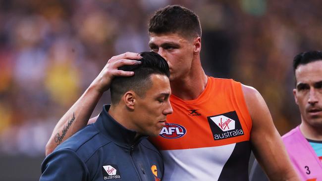 Giant Jonathon Patton consoles Dylan Shiel who was forced to sit out the game with concussion. Picture. Phil Hillyard