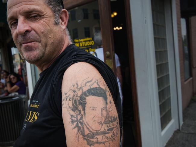 Elvis Presley fan Eric Philiponska, from France, shows off his tattoo of The King before visiting Sun Studio, where Presley made his first recordings. Picture: AFP