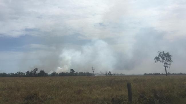 A file photo shows smoke from a former bushfire at Woodgate.