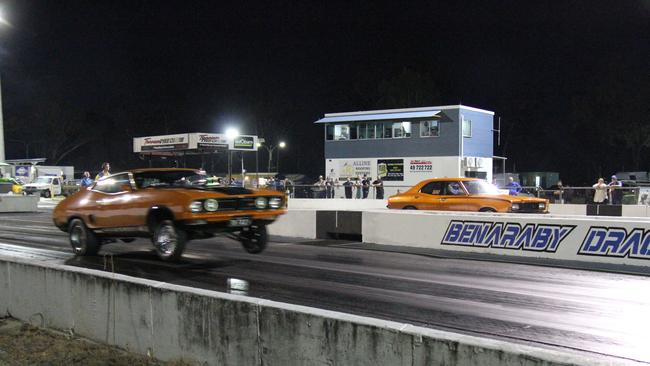 Brett Kelly launches the front wheels off the ground as Todd Marshall waits for his light to go green at Benaraby dragway. Picture: Rodney Stevens