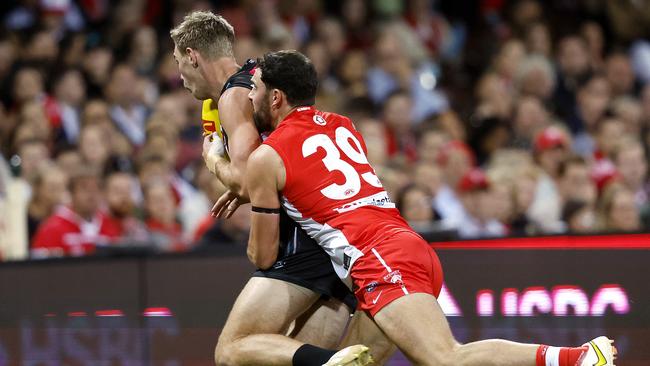 McCartin lays a tackle before succumbing to a concussion. Photo by Phil Hillyard