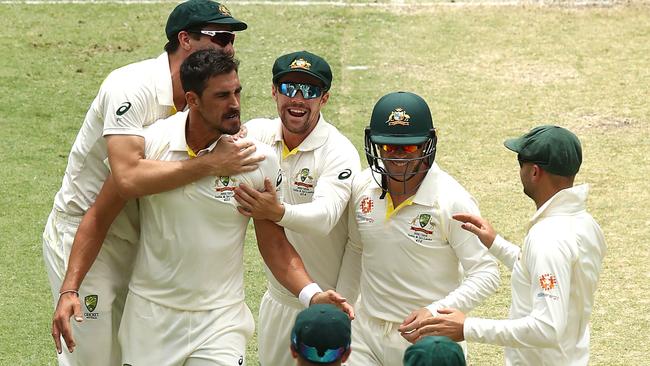 Mitchell Starc celebrates after taking the wicket of Murali Vijay on day two. Picture: Getty Images