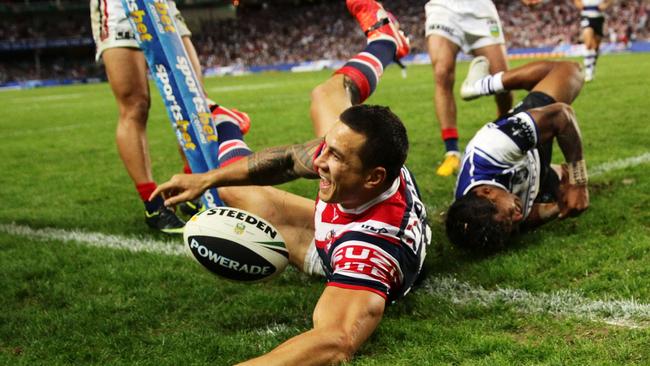 Sonny Bill Williams beats Ben Barba to score against his former team, the Bulldogs. Picture: Matt King/Getty Images